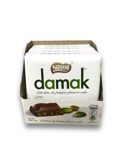 Nestle Damak Milk Chocolate Pistazie 60g Vorderseite weiße Verpackung auf weißem Hintergrund